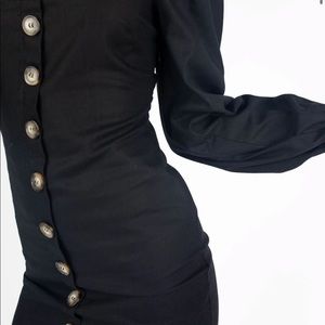 Brand new black kittenish dress in black.